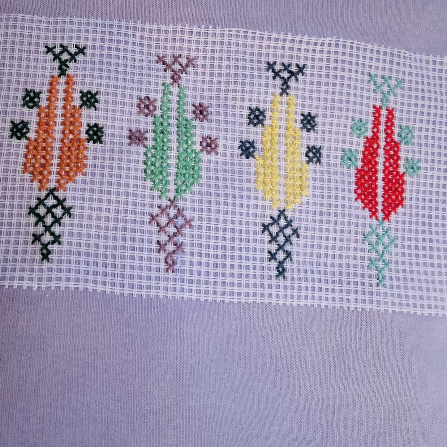 Colorful tatreez embroidery pattern stitched using 11ct waste canvas grid