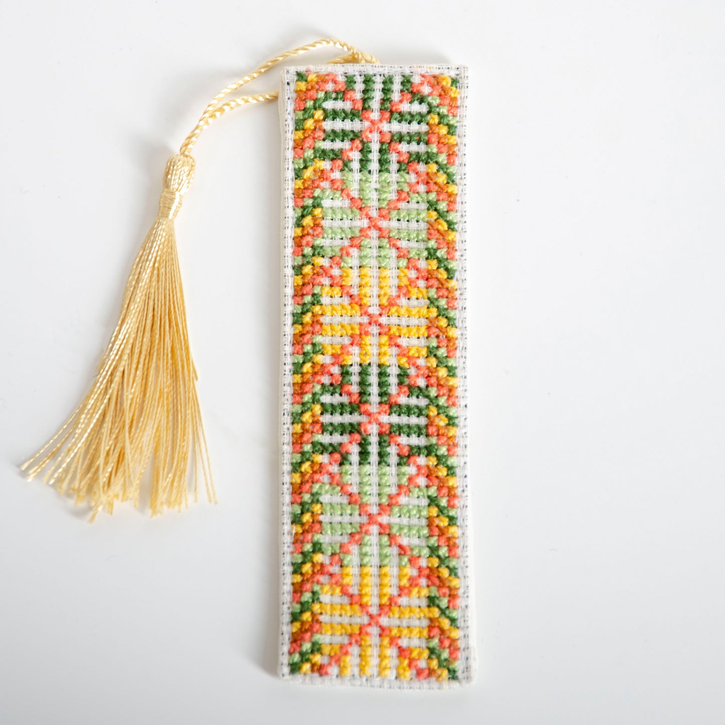 Handmade Palestinian tatreez bookmark featuring Kees Dukhan embroidery pattern