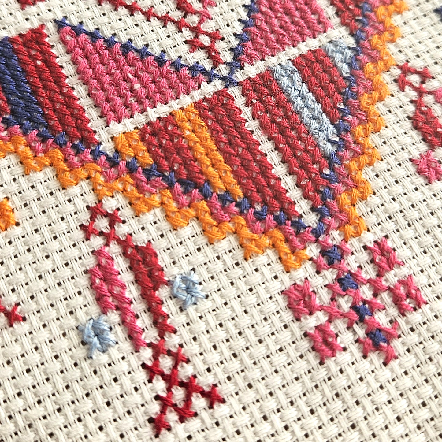 Close-up of Cypress of Gaza Tatreez cross stitch showing detailed embroidery pattern and thread texture