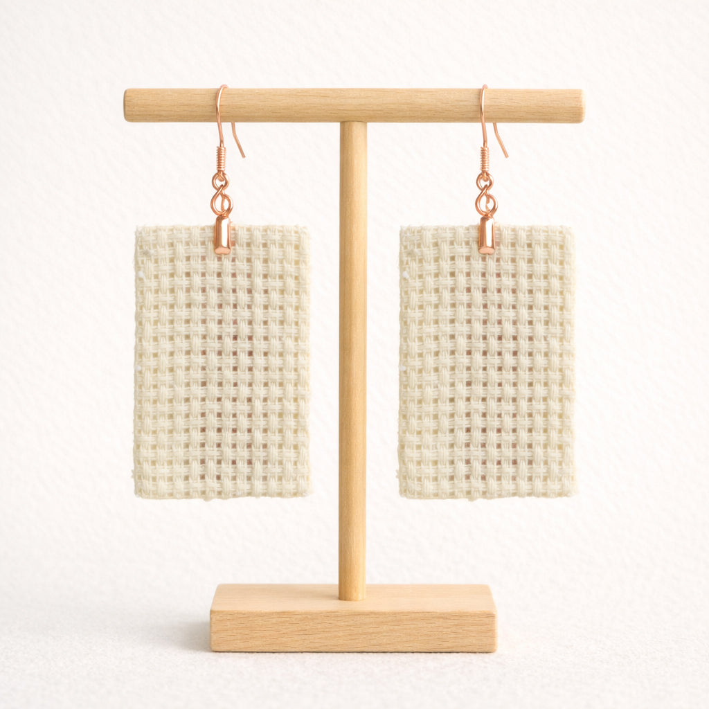 Back view of handmade tatreez earrings with Sarwa cypress tree Ashdod pattern on textile base