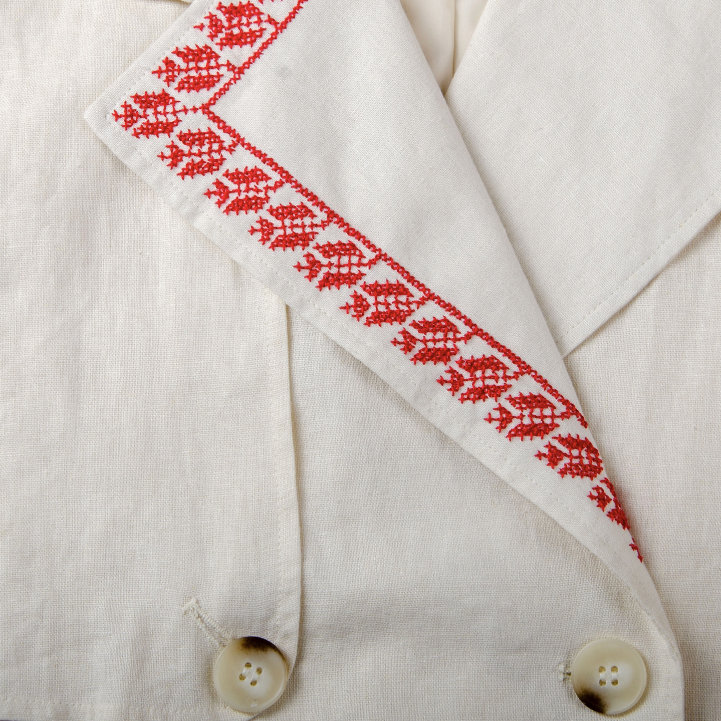 Red tatreez embroidery on fabric created using 14ct waste canvas guide