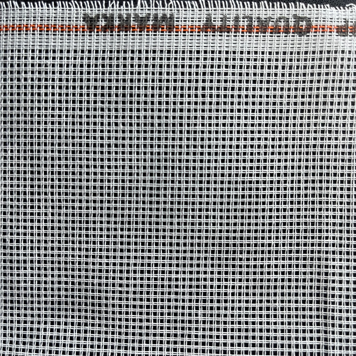 Close-up of white 11ct waste canvas grid for embroidery stitching