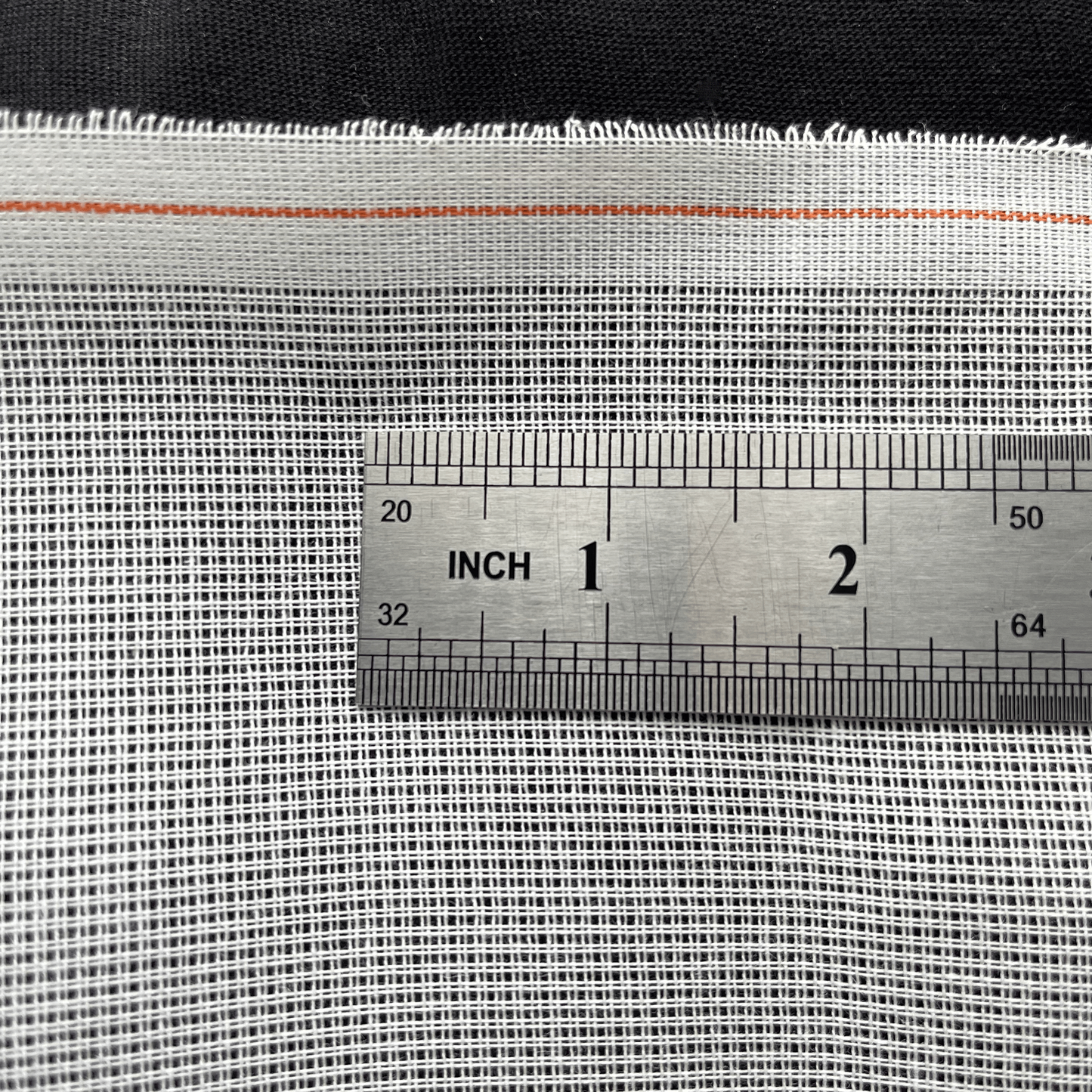 White 14ct waste canvas with ruler showing stitch count and grid spacing