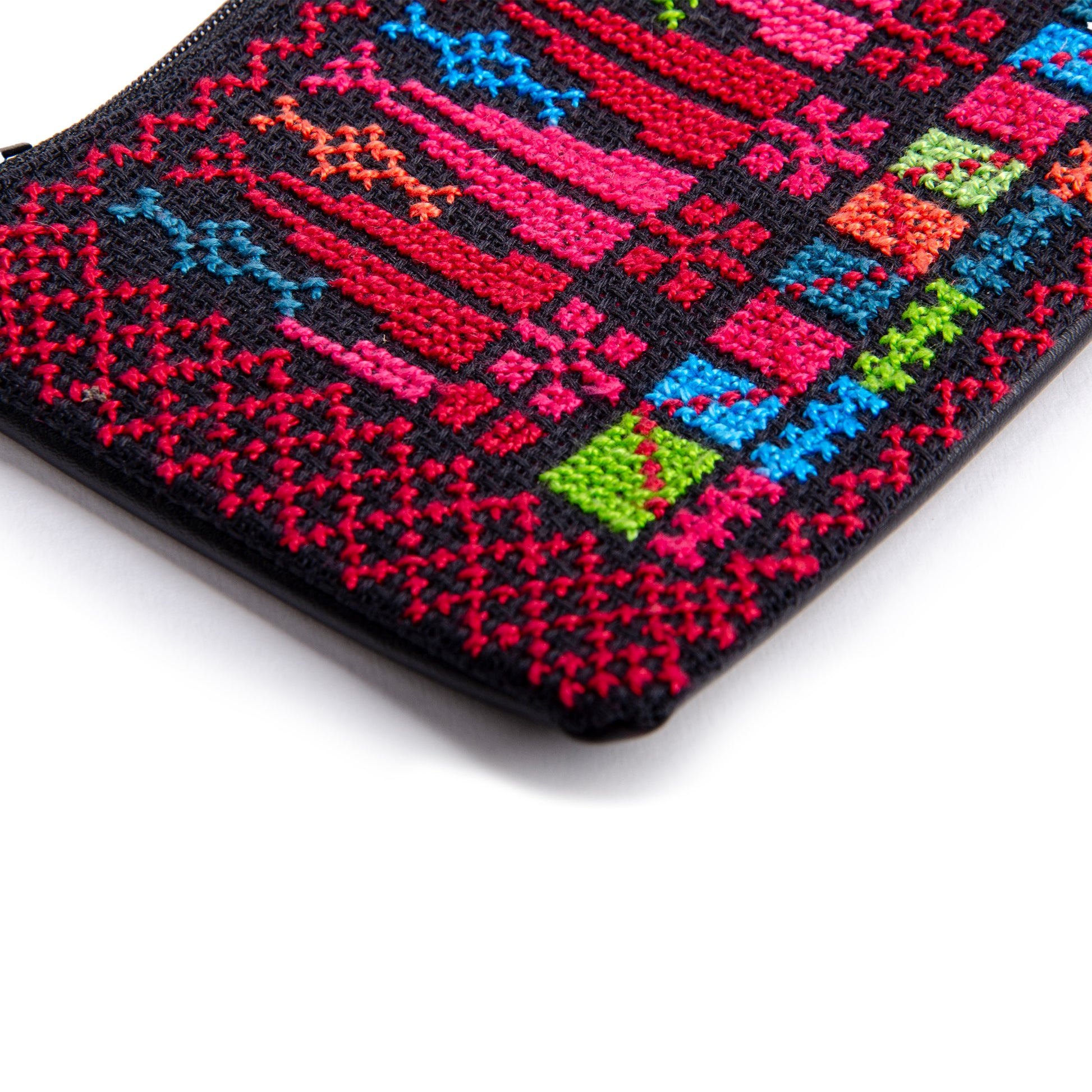 Close-up of handmade Palestinian embroidered purse with traditional Tatreez cypress motif, size 15x10 cm.
