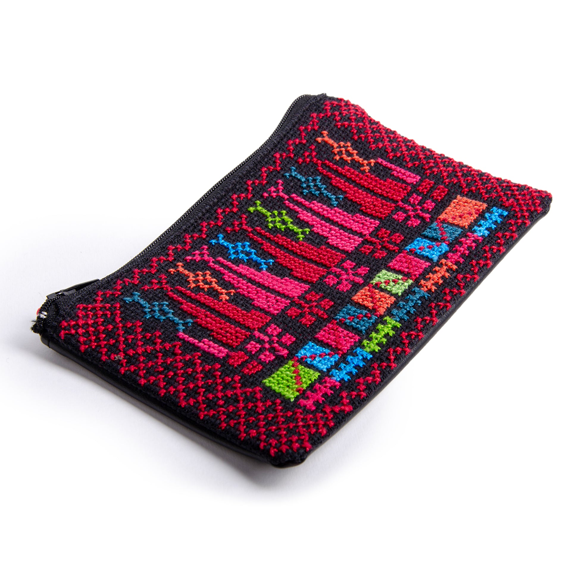 Side perspective of handmade Palestinian embroidered purse featuring traditional Tatreez cypress motif, size 15x10 cm.