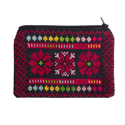 Front view of handmade Palestinian embroidered purse featuring floral Tatreez design, size 15x10 cm.
